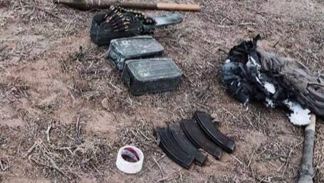A photograph provided by the Israeli Defense Forces shows weapons near Sufa, Israel, where Hamas militants used a tunnel from inside the Gaza Strip to get near Sufa on Thursday.
