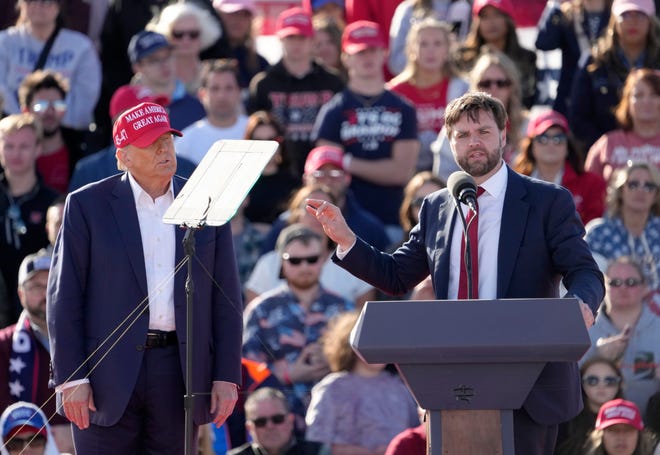 Former President Donald Trump appears with U.S. Senator JD Vance outside Wright Bros.
