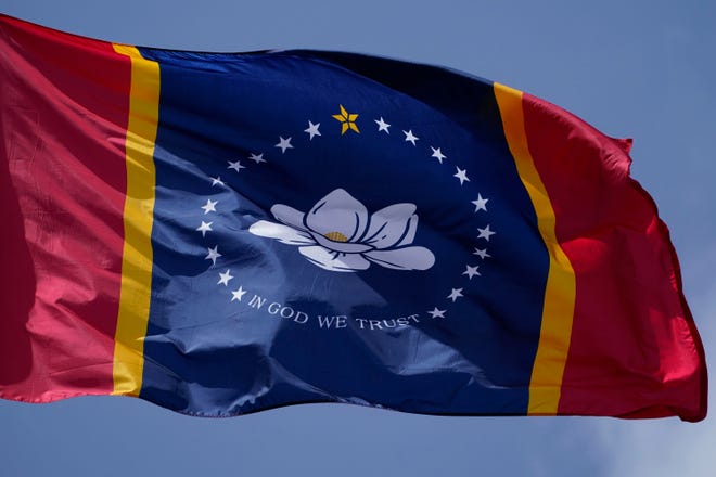 The magnolia-centered banner chosen by the Mississippi State Flag Commission is displayed outside the Old State Capitol Museum in downtown Jackson, Miss., on Sept. 2.
