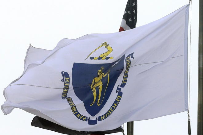 The Massachusetts state flag, which dates to the late 19th century and is on track to be replaced, flies in front of Boston City Hall in 2016.