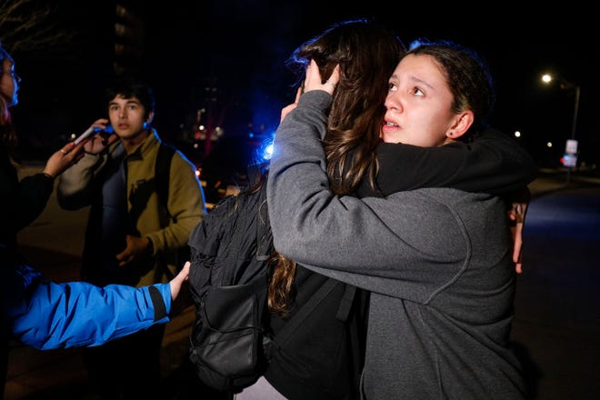 Michigan State University students hug during an active shooter situation on campus on February 13, 2023 in Lansing, Michigan.