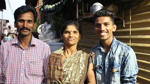 Chhavi Goyal Omkar with his parents Raju and Kanta, who say they have seen significant changes in his behaviour since starting the programme (Credit: Chhavi Goyal)