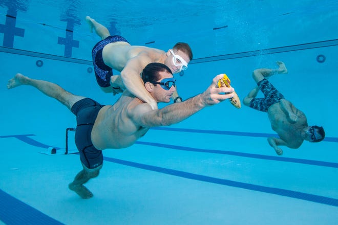 Peter Belden, the co-captain of the Newport Mesa Guppies, trains with a teammate at the Orange Coast College pool on July 3 2023 in Costa Mesa, CA.