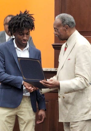 Corion Evans, 16, helped save three female victims and a police officer after he saw their car drive off the Interstate 10 boat launch into the water on July 3, 2022.