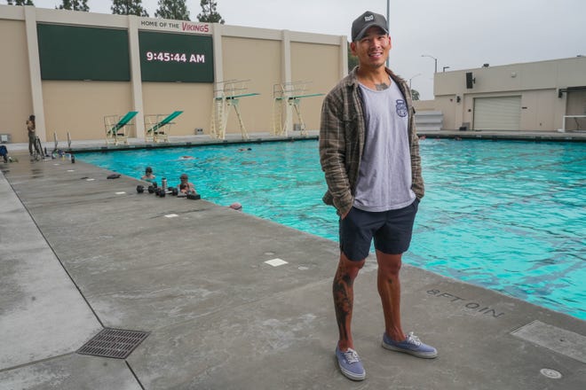 Don Tran, the co-founder and the CFO of the Underwater Torpedo League, stands by the pool at Long Beach City College on July 2 2023. The Underwater Torpedo League is one of the newest sporting leagues in Southern California, training both physical and mental fitness, and forcing players to stay calm underwater.