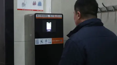 VCG/Getty Images Facial recognition to access toilet roll in Beijing