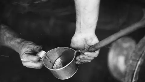Getty Images A man producing poitin