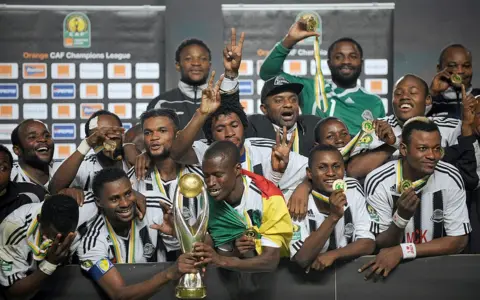AFP TP Mazembe celebrate winning the CAF Champions League trophy after beating Tunisia's Esperance de Tunis in the final in Tunis, in November 2010.
