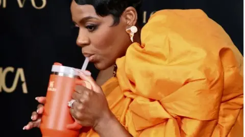 Getty Images Actress and singer Fantasia Barrino takes a sip from her Stanley cup at the Astra Film Awards earlier this month