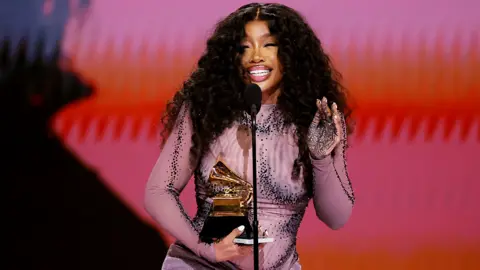 Getty Images SZA accepts the Best R&B Song award for "Snooze" onstage during the 66th GRAMMY Awards at Crypto.com Arena on February 04, 2024 in Los Angeles, California