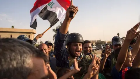 AFP Iraq's federal police members celebrating in Mosul
