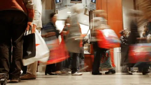 Getty Images Holiday season shoppers