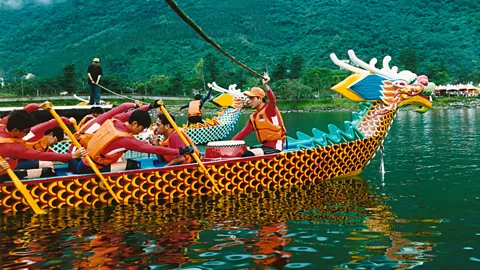 Dragon boat teams get ready for the starting gun on Lake Liyu. (Lottie Davies)