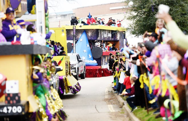 Floats travel down Clyde Fant Parkway in downtown Shreveport, La., during the 29th Annual Krewe of Centaur Mardi Gras Parade in February. The 2021 parade has been canceled because of concerns about the new coronavirus.