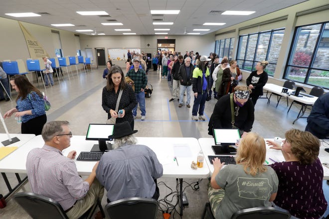 Poll workers assist voters at First United Methodist Church on Election Day Nov. 5, 2024, in Appleton, Wisconsin.