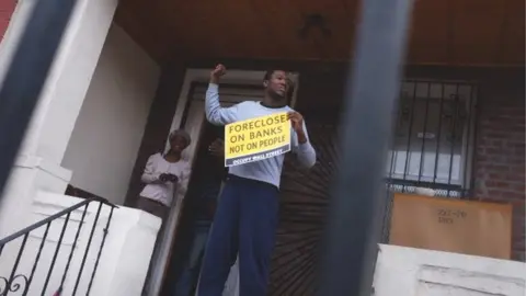 Getty Images US man protests about foreclosures in 2011
