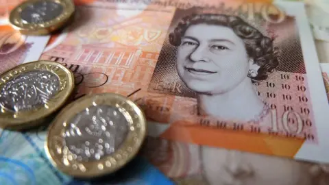 Getty Images £10 note and pound coins