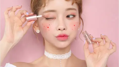Beige Chuu A model wearing Beige Chuu Korean makeup