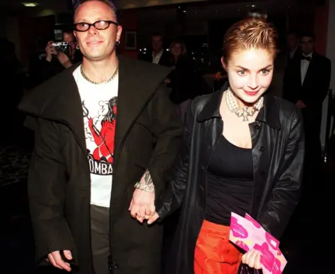 PA Keith Flint and Gail Porter walking hand-in-hand