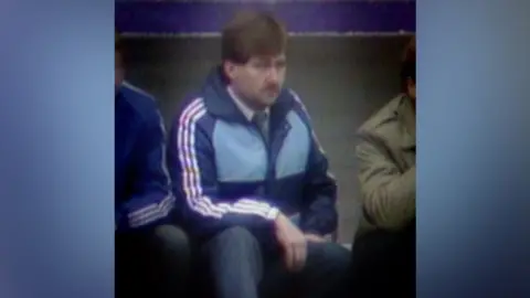 Gordon Neely in the Hibs dugout