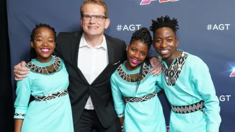 Getty Images Ralf Schmitt and members of the choir