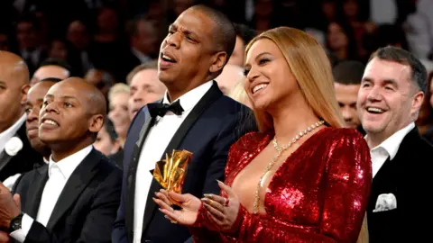 Getty Images Terry George with Jay-Z and Beyonce at the 2017 Grammys