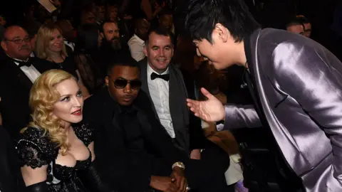Getty Images Terry George with Madonna, Nas and Lang Lang at the 2015 Grammys