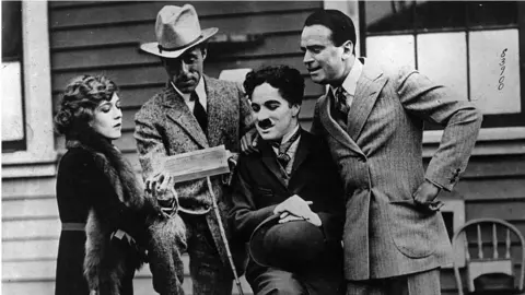 Getty Images Silent era film stars (from left) Mary Pickford, David Griffith, Charlie Chaplin and Douglas Fairbanks