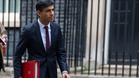 PA Media Chancellor Rishi Sunak in Downing Street, London, as the UK enters a seventh week of lockdown to help stop the spread of coronavirus