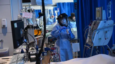 Getty Images Clinical staff wear Personal Protective Equipment (PPE) as they care for a patient at the Intensive Care unit at Royal Papworth Hospital on May 5, 2020 in Cambridge, England