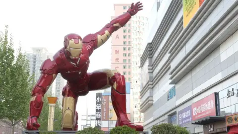 Getty Images A sculpture of Iron Man, a fictional superhero from Marvel Comics, outside a shopping mall in Zhengzhou in central China's Henan province