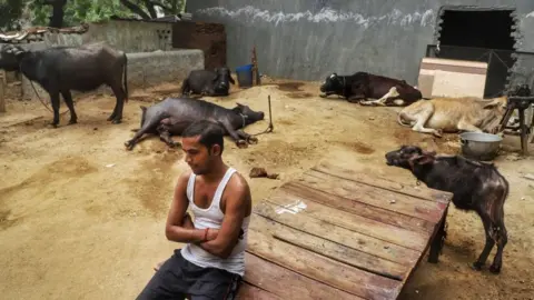 Getty Images A migrant worker Ajay Kumar, 33, who's stuck in New Delhi, is dejected after he tried to book his train ticket multiple times in which he eventually failed to succeed in New Delhi, India on 13 May 2020. He is keen to join back his family. (