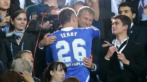 PA Media Roman Abramovich embraces John Terry