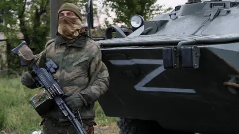 Reuters A Russian soldier in Mariupol