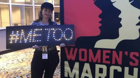 Getty Images Athena Soules holds up her "#metoo" sign