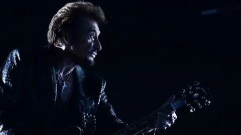 AFP/Getty Images Johnny Hallyday performs in Moscow, Russia. Photo: October 2012