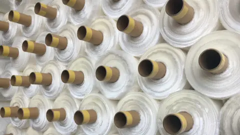The fabric is exported in large rolls