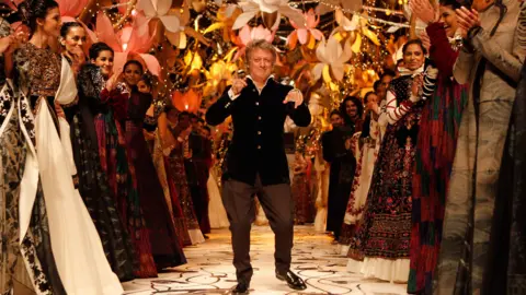 Getty Images Indian fashion designer Rohit Bal walks on the ramp during the Indian Bridal Fashion Week 2013 held at The Grand on July 26, 2013 in New Delhi, India. 