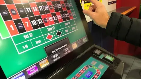 Reuters Person on fixed odds betting terminal