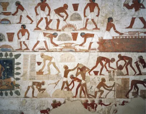 Getty Images A painting of workers making bricks from the tomb of Rekhmire in Thebes, Egypt