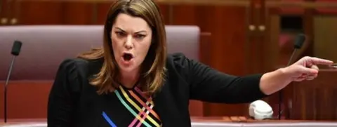 EPA Sarah Hanson-Young speaks in the Senate, with her finger pointing sharply across the chamber