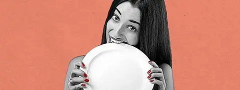 Getty Images Woman pretending to eat a plate