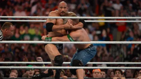 Getty Images Dwayne ''The Rock'' Johnson and John Cena in action during WrestleMania XXVIII in 2012