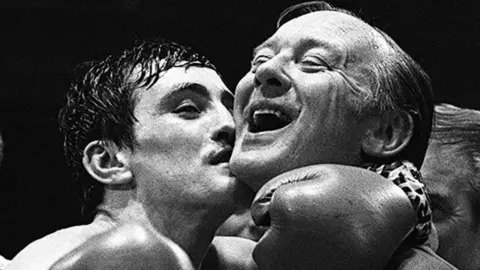 Pacemaker Barry McGuigan pictured with Barney Eastwood in 1983 after he claimed the European featherweight title in the King's Hall