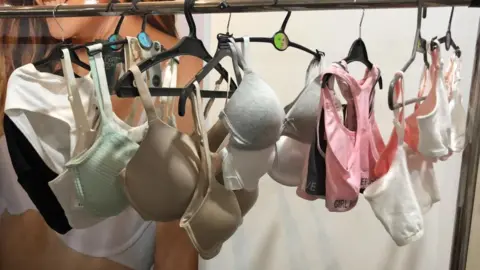 BBC A rack of bras in the factory