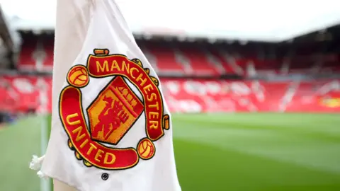 Getty Images Corner flag featuring the Manchester United badge at Old Trafford