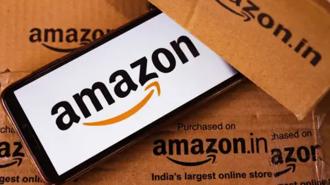 Getty Images Image of Amazon logo with delivery boxes.