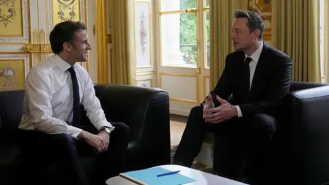 Getty Images Emmanuel Macron met with Elon Musk at the Elysee Palace in May