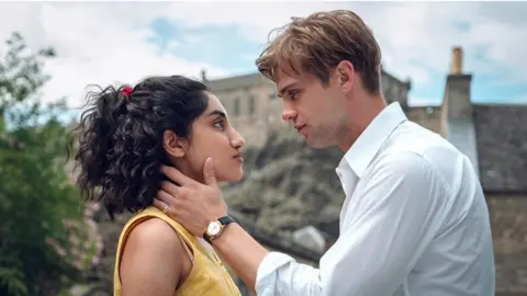 Netflix Ambika Mod and Leo Woodall as Emma and Dexter in One Day