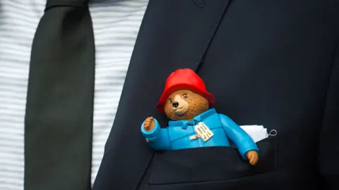 PA Paddington Bear toy in jacket pocket